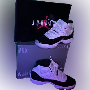 Black and white Jordan’s 11 with the 45 on the back